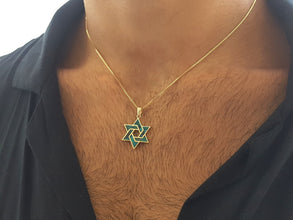 14k gold star of david pendant on men 