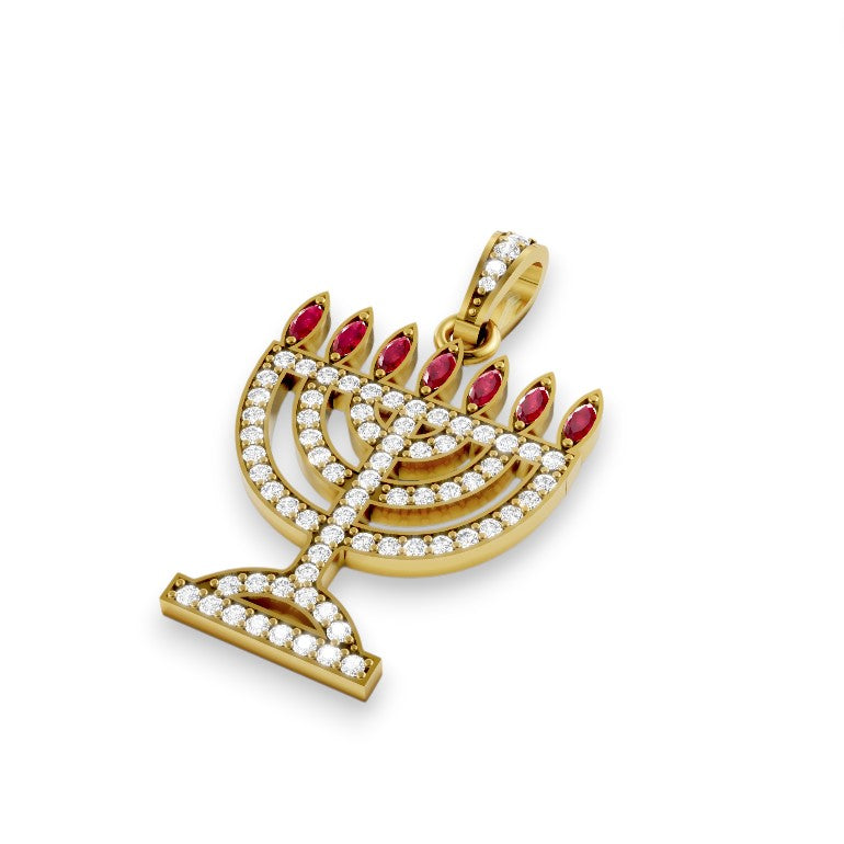 Gold menorah pendant with red stones on a white background
