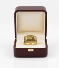 Gold Jerusalem  ring in an open brown jewelry box on a white background