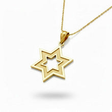 Gold star of David shaped pendant on a white background