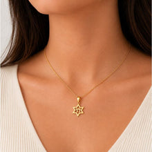 Gold star of David chai pendant on women 