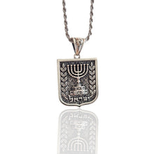Silver Menorah pendant with chain on a white background