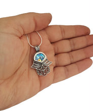 A 925 sterling silver Roman glass Hamsa pendant necklace with a silver chain and intricate filigree work.