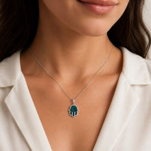women is wearing silver eilat stone hamsa 