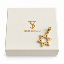 Gold Star of David pendant on a box