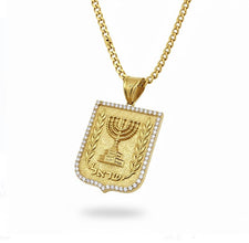 Gold necklace with a pendant featuring a menorah design on a white background