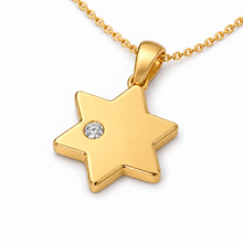 Polished gold Star of David pendant with an off-center lab-grown diamond 