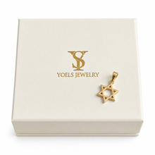 Gold Star of David pendant on a box