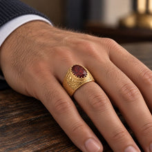 Men’s 14K yellow gold Jerusalem ring featuring an oval garnet stone