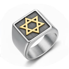 Silver ring with a gold Star of David on a white background