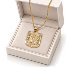 gold Lion of Judah pendant displayed in an open cream jewelry gift box