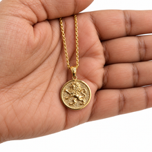 gold lion of Judah pendant on palm