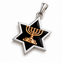 Silver Star of David pendant with black enamel and 9K gold Menorah on white background