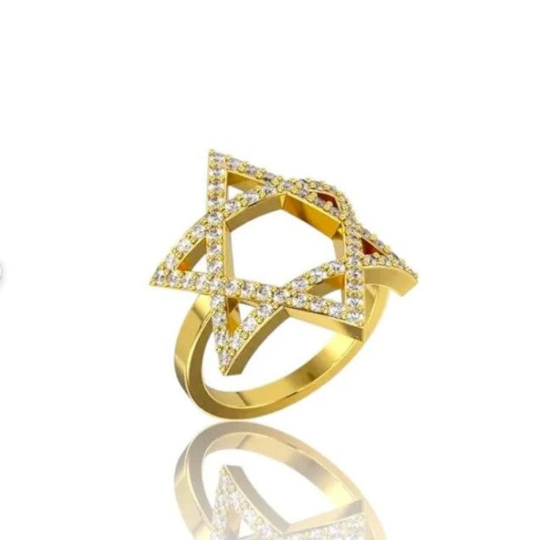 Gold ring with diamond accents on a white background