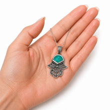 Filigree Hamsa pendant in sterling silver set with Eilat stone, intricate Yemenite design symbolizing protection, blessing and spiritual connection handcrafted in Israel