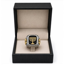 Ring with Menorah design in a black box on a white background