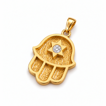 Close-up of textured gold Hamsa pendant with a central lab-grown 