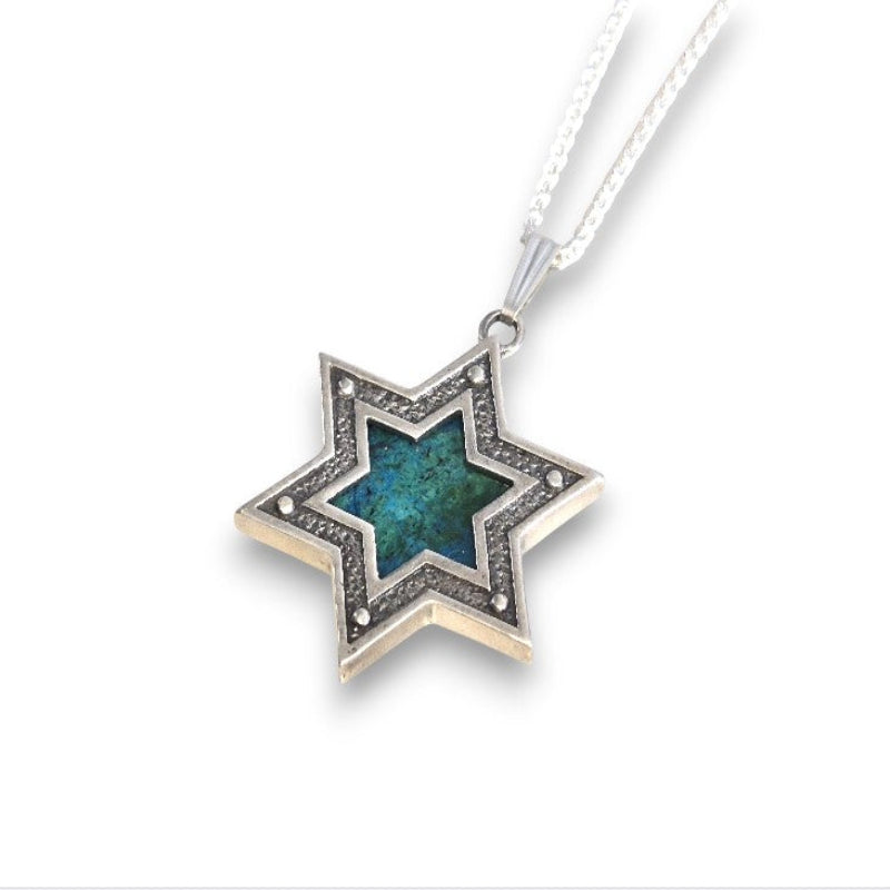 Star-shaped pendant with blue center and silver frame on a white background
