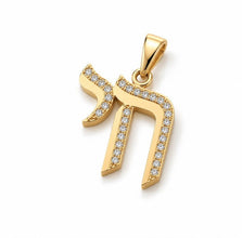 A gold Hebrew letter pendant, representing the letter 'Havva' (חו) with pavé-set clear stones along its edges, shown on a clean white background.