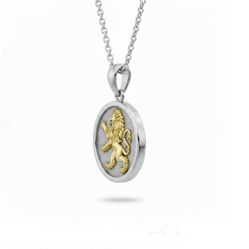 Silver pendant with gold lion emblem on a white background