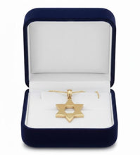 Gold Star of David necklace in a blue velvet box on a white background