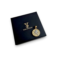 Gold lion pendant on a black box with 'Voels Jewelry' logo