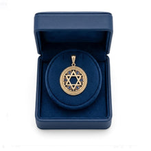 Gold Star of David pendant with blue stones in a blue jewelry box