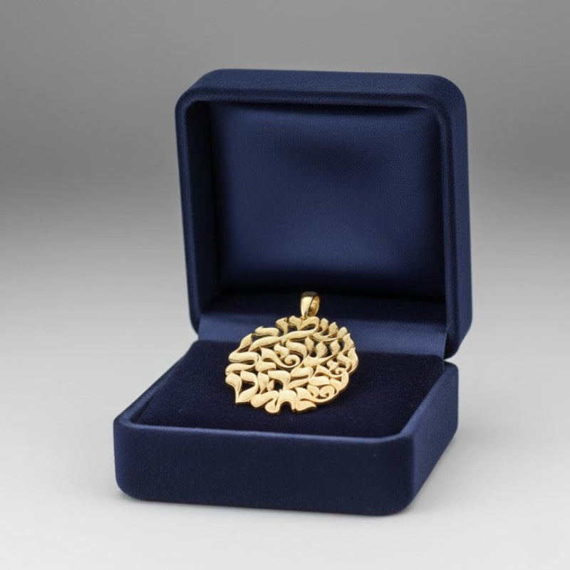 Gold necklace pendant in a blue jewelry box on a gray background