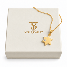 Small gold Star of David pendant with lab-grown diamond and chain on a Yoel’s Jewelry gift box