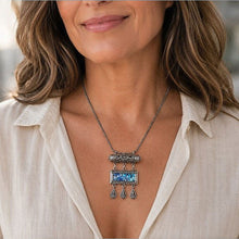 Women is wearing Roman glass yemenite filigree amulet  necklace 
