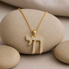 luxury judaica jewelry chai necklace on rock 
