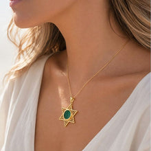women is wearing  gold Eilat Stone Star of David pendant
