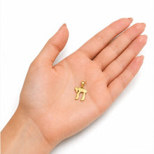 gold chai necklace on hand
