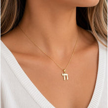 14k gold chai pendant on a women 