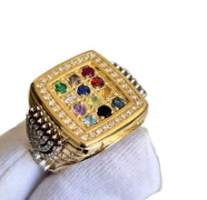 Gold ring with gemstones on a white background