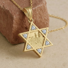 Gold Star of David pendant with embedded stones on a beige background