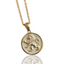 Gold necklace with a lion if Judah pendant on a white background