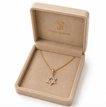Gold  star of David necklace with star pendant on box