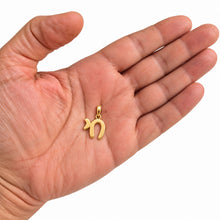Delicate gold Chai pendant on hand