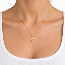 women is wearing 14K gold Chai pendant 