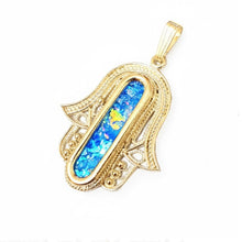 Gold pendant with blue opal stone on a white background