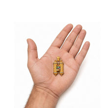 Large 14K gold Hoshen Torah scroll pendant with diamonds displayed on a man’s hand