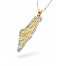 Gold pendant necklace with intricate design on a white background