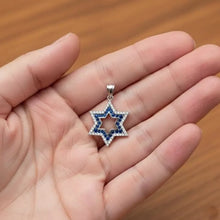 Star of David necklace in solid 14K gold with diamonds and sapphire, Israel flag design on hand