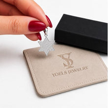 14K white gold Star of David pendant with lab grown diamonds held by woman hand – Jewish jewelry from Israel
