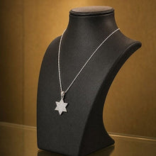 Diamond Star of David pendant in 14K white gold with chain on elegant black necklace display
