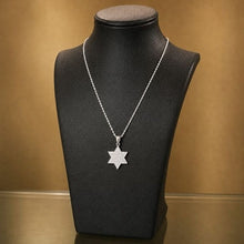 Diamond Star of David pendant in 14K white gold with chain on elegant black necklace display