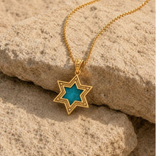 14K gold of David Pendant with Eilat Stone Displayed on Natural Stone