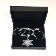 silver star of David pendant set with Roman glass