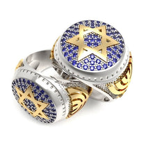 A 14k gold men's ring featuring a Star of David design with blue sapphires and yellow gold accents.